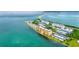 Bird's eye view of waterfront condos with boat docks, pools, and bay views at 9 Haig Pl # 510, Dunedin, FL 34698