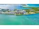 Stunning aerial view of waterfront property with beautiful turquoise water and scenic shoreline at 9 Haig Pl # 510, Dunedin, FL 34698