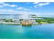 An aerial shot showcases waterfront condos surrounded by a lush and picturesque tropical landscape at 9 Haig Pl # 510, Dunedin, FL 34698