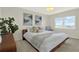 Bright bedroom with a window view, featuring stylish decor and a comfortable bed, creating a serene atmosphere at 9 Haig Pl # 510, Dunedin, FL 34698