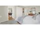Bright bedroom with a glimpse into the living room, featuring a spacious closet and stylish decor at 9 Haig Pl # 510, Dunedin, FL 34698
