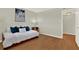 Cozy bedroom featuring a stylish daybed, a wood floor, and natural light, creating a comfortable atmosphere at 9 Haig Pl # 510, Dunedin, FL 34698
