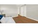 Bright bedroom featuring a stylish wood floor, a closet, and natural light, creating a comfortable atmosphere at 9 Haig Pl # 510, Dunedin, FL 34698