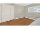 Bright bedroom featuring natural light, a wood floor, and a spacious closet, creating a comfortable atmosphere at 9 Haig Pl # 510, Dunedin, FL 34698