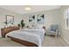 Bright bedroom with soft natural light, stylish decor, and comfortable seating, creating a serene and inviting atmosphere at 9 Haig Pl # 510, Dunedin, FL 34698