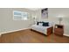Cozy bedroom featuring natural light, a stylish daybed, and a wood floor, creating a relaxed atmosphere at 9 Haig Pl # 510, Dunedin, FL 34698