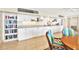 Common area featuring a countertop with sink and storage, a bookshelf, and seating at a table with four chairs at 9 Haig Pl # 510, Dunedin, FL 34698