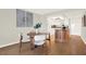Dining area with a round table, stylish chairs, and a view into the modern kitchen at 9 Haig Pl # 510, Dunedin, FL 34698