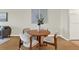 Cozy dining area featuring a round table, comfortable chairs, and modern decor at 9 Haig Pl # 510, Dunedin, FL 34698