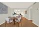 Dining area with a round table, seating for four, and a view to the bright kitchen at 9 Haig Pl # 510, Dunedin, FL 34698