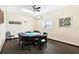 Cozy game room featuring a round table with chairs for card and board games at 9 Haig Pl # 510, Dunedin, FL 34698