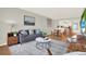Comfortable living room with modern decor, plush seating, and an open layout leading to the kitchen at 9 Haig Pl # 510, Dunedin, FL 34698