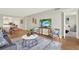 Inviting living room featuring stylish furniture, wood floors, and a serene atmosphere with a view of the bedroom at 9 Haig Pl # 510, Dunedin, FL 34698