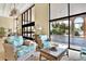 Lobby area featuring comfortable seating, large windows, and views of the property entrance at 9 Haig Pl # 510, Dunedin, FL 34698