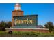 Elegant brick and stone welcome sign with lush landscaping marks the entrance to Connerton, a beautiful community at 9451 Raised Tulip Ln, Land O Lakes, FL 34637