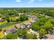 An aerial view that shows the property's location in a serene, wooded neighborhood at 10617 Lucaya Dr, Tampa, FL 33647