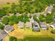 Aerial view of the property with the community, landscaping, and pond at 10617 Lucaya Dr, Tampa, FL 33647