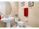 A quaint powder room featuring tile floors and neutral paint at 10617 Lucaya Dr, Tampa, FL 33647