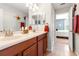 Bathroom featuring double sinks with wood cabinets at 10617 Lucaya Dr, Tampa, FL 33647
