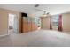 Spacious bonus room boasts neutral carpeting, built-in storage, and an overhead ceiling fan at 10617 Lucaya Dr, Tampa, FL 33647
