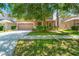 Charming two-story home with a two-car garage and manicured landscaping in a desirable neighborhood at 10617 Lucaya Dr, Tampa, FL 33647