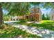Charming two-story home with manicured landscaping and mature trees in a desirable neighborhood at 10617 Lucaya Dr, Tampa, FL 33647