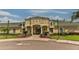 Community clubhouse featuring manicured landscaping and neutral color palette at 10617 Lucaya Dr, Tampa, FL 33647