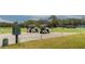 Golf carts parked near the tee boxes, offering convenience and easy access to the course at 10617 Lucaya Dr, Tampa, FL 33647