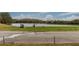 Scenic golf course featuring a lake, a manicured tee box, and lush green surroundings at 10617 Lucaya Dr, Tampa, FL 33647