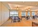 Community clubhouse common area with a wall of windows and an array of tables and chairs at 10617 Lucaya Dr, Tampa, FL 33647