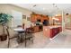 Bright kitchen with granite countertops, stainless steel appliances, a large island, and breakfast nook at 10617 Lucaya Dr, Tampa, FL 33647