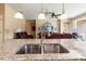 Granite counters and stainless sink highlight this kitchen at 10617 Lucaya Dr, Tampa, FL 33647