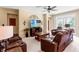 Spacious living room complete with ceiling fan and large windows at 10617 Lucaya Dr, Tampa, FL 33647