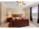 Comfortable main bedroom with a cozy bed and natural light from the window at 10617 Lucaya Dr, Tampa, FL 33647
