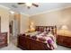 Inviting main bedroom boasts a cozy bed and well-lit bedside tables at 10617 Lucaya Dr, Tampa, FL 33647
