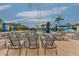 Community pool deck area with plenty of lounge chairs and umbrellas at 10617 Lucaya Dr, Tampa, FL 33647