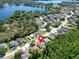 Lovely aerial shot of a beautiful neighborhood with mature trees and well-cared-for homes near the lake at 1135 Wyndham Lakes Dr, Odessa, FL 33556