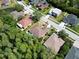 Lovely aerial view of residences nestled among the lush greenery of a desirable neighborhood at 1135 Wyndham Lakes Dr, Odessa, FL 33556