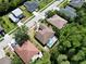 Wide aerial view of the property, lush greenery, and surrounding neighborhood at 1135 Wyndham Lakes Dr, Odessa, FL 33556