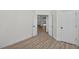Bedroom with open doors to the bathroom and entry, showcasing seamless flow and ample space at 1135 Wyndham Lakes Dr, Odessa, FL 33556