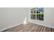 Bedroom with large window providing ample natural light at 1135 Wyndham Lakes Dr, Odessa, FL 33556