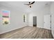 Bedroom featuring large windows providing ample natural light at 1135 Wyndham Lakes Dr, Odessa, FL 33556