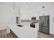 Bright kitchen featuring modern appliances, ample counter space, and sleek white cabinetry at 1135 Wyndham Lakes Dr, Odessa, FL 33556