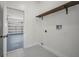 Functional laundry room offering ample space and storage with an open doorway leading to a garage at 1135 Wyndham Lakes Dr, Odessa, FL 33556