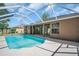 A private pool within a screened enclosure offers a refreshing escape and a relaxing outdoor space at 1135 Wyndham Lakes Dr, Odessa, FL 33556