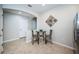 Cozy breakfast nook features a glass table and unique wall decor at 11833 Castine St, New Port Richey, FL 34654