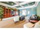 Cozy living room features a large entertainment center and comfortable seating for relaxation at 11833 Castine St, New Port Richey, FL 34654