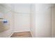 Empty walk-in closet with wood-look flooring and white wire shelving at 11833 Castine St, New Port Richey, FL 34654