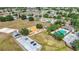 Aerial view featuring a community park with a pool, playground, and green space, perfect for recreation at 12322 Hawkeye Point Pl, Riverview, FL 33578