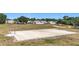 Basketball court in a community, adjacent to a playground and green space at 12322 Hawkeye Point Pl, Riverview, FL 33578